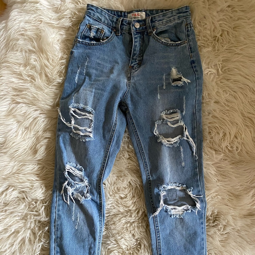 blue straight legged ripped jeans